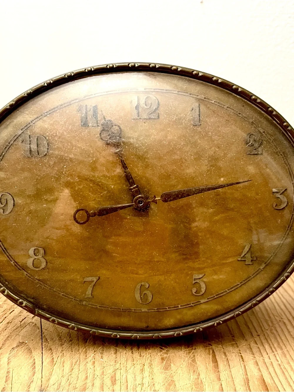 Vintage Oval brass Clock. 5” wide on brass stand